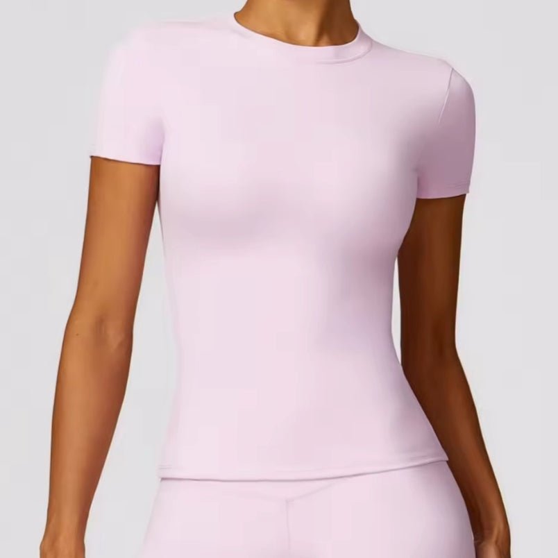 Soft pink fitted top from womens fashion online UAE, perfect for casual wear or workouts